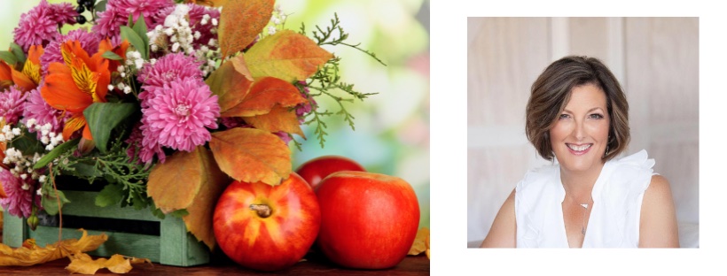 Photo of Marian Taylor next to flowers and apples