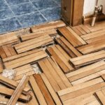 A water damaged floor in need of repair.